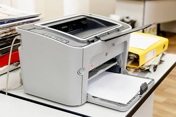 istock Printer in the office among papers and folders 536034371