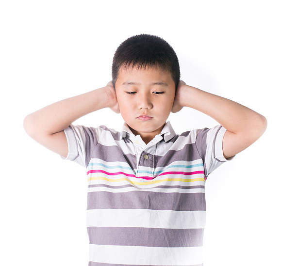 istock Boy hands off covering ears from loud noise 536034677