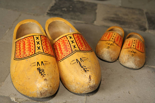 Typical pair of father and son dutch wooden shoes stock photo
