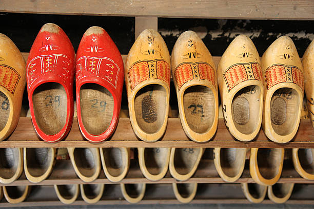 Typical dutch wooden shoes on a shelf stock photo