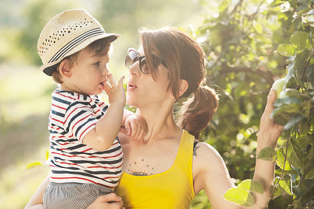 istock Young Mother and her Son Picking Apple 536035575