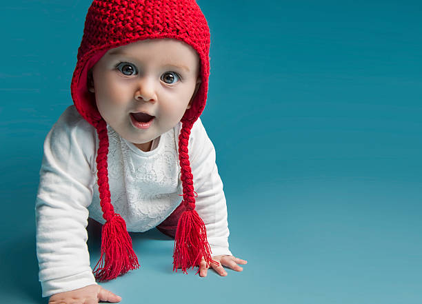 удивлен ребенок - front view female isolated on red happiness стоковые фото и изображения