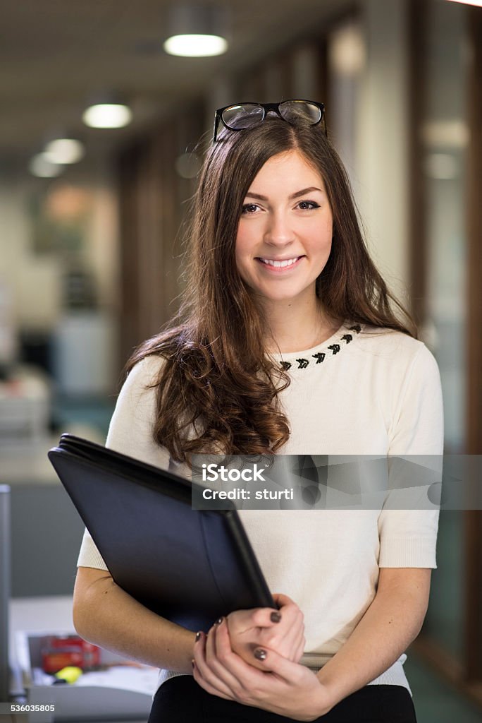 young female office worker young woman in an open plan office 20-24 Years Stock Photo