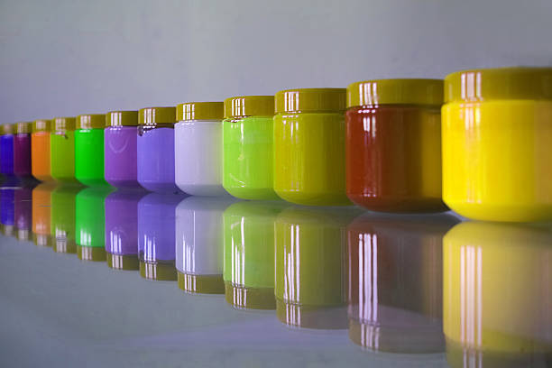 Plastic Jars of Acrylic Ordered in Line stock photo