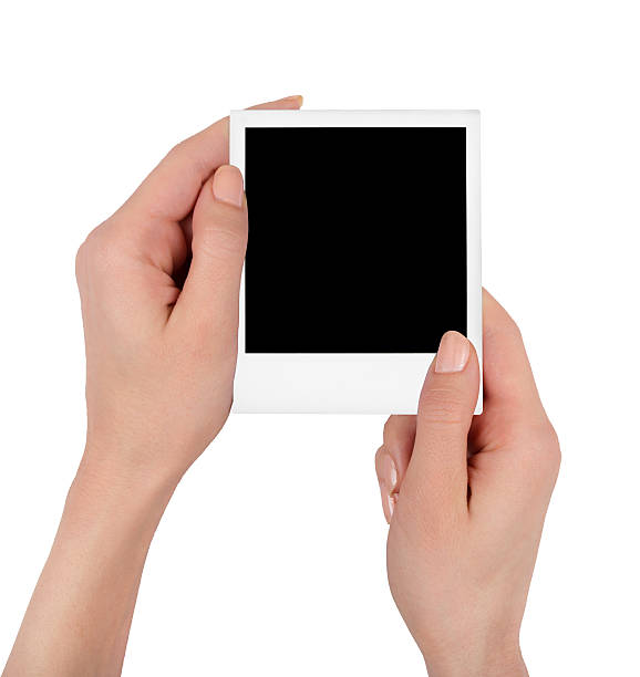 istock Instant photo in female hand 536036535