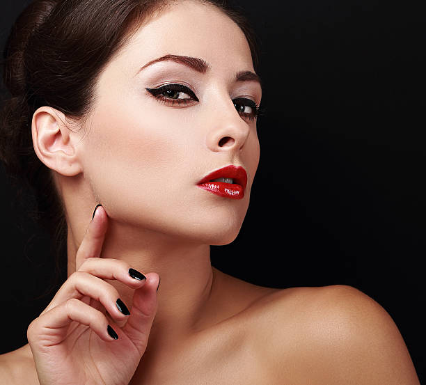 istock Perfect makeup woman face with red lips and black nails 536036831