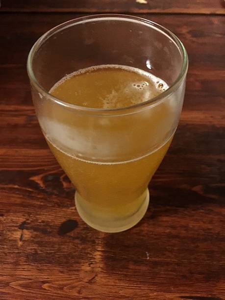 istock cold glass of wheat beer on wood table 536048451