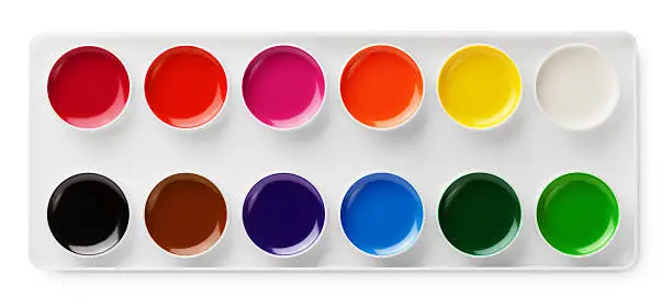 Photo of watercolor paints in box isolated on white