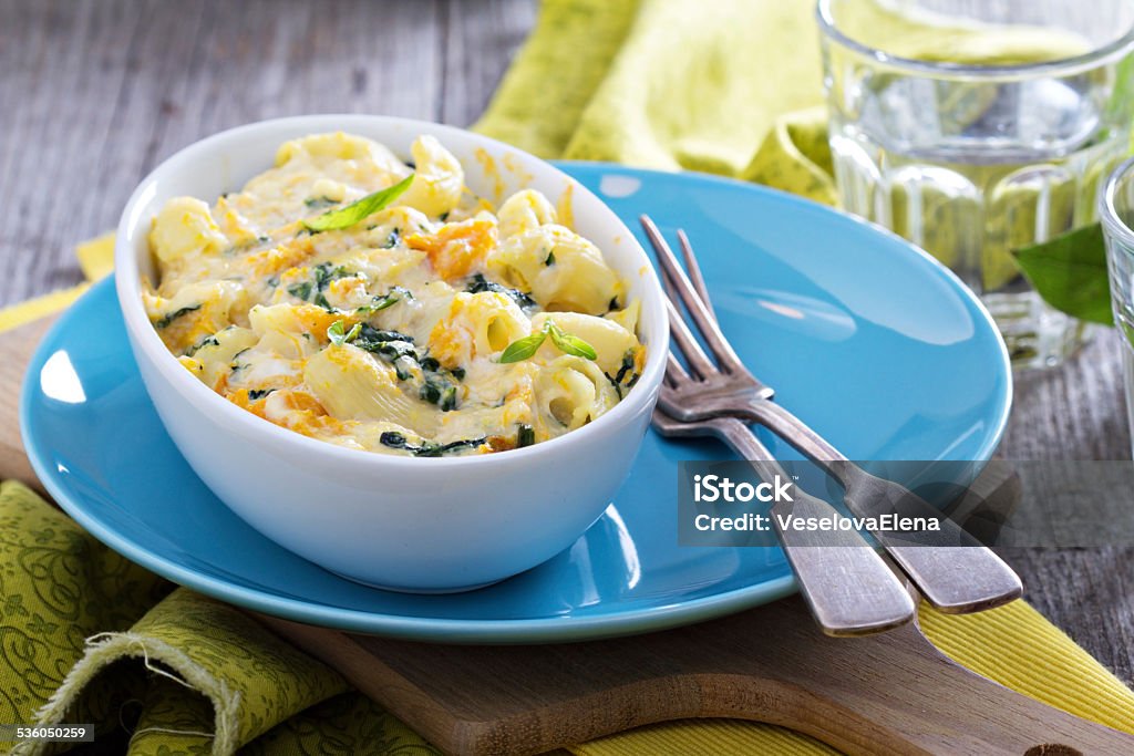 Baked macaroni and cheese with pumpkin Baked macaroni and cheese with pumpkin and spinach Ricotta Stock Photo