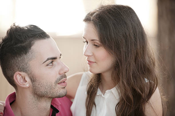 istock Young Couple Embracing and Smiling 536050393