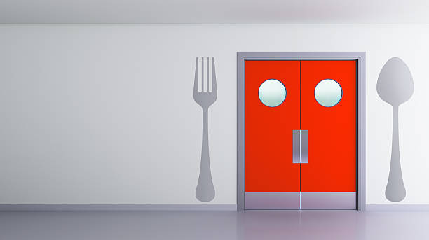 kitchen swing door with fork and spoon stock photo