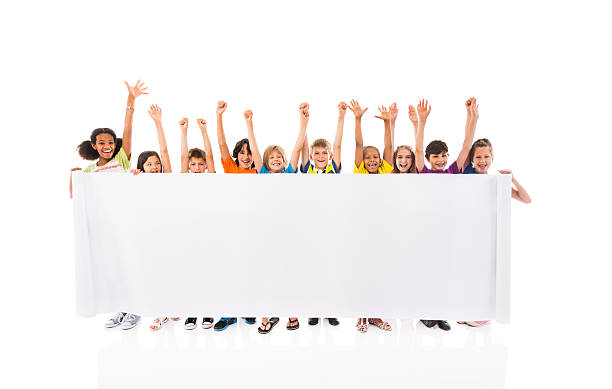 istock Large group of cheerful children holding white banner. 536053005