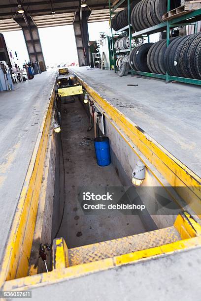 Mechanic Pit In Concrete Floor Of Autobody Shop Stock Photo - Download Image Now - 2015, Auto Repair Shop, Color Image