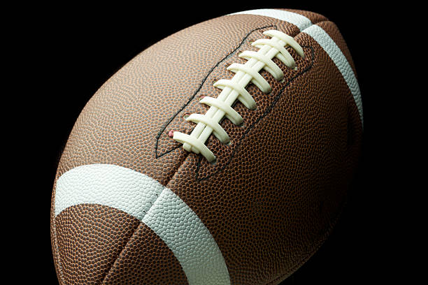 istock Generic American Football Closeup in Dramatic Lighting 536058039