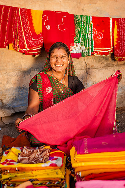 istock Indian woman selling colorful fabrics 536059003
