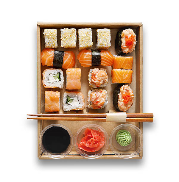 Set of sushi maki and rolls at box isolated.