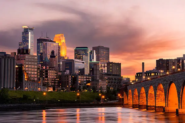 Minneapolis Minnesota Downtown and the Stone Arch Bridge at Sunset