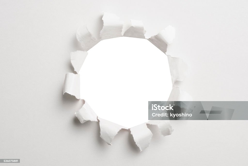 エクスプローディングホールには、白色の背景に白色用紙 - 2015年のロイヤリティフリーストックフォト
