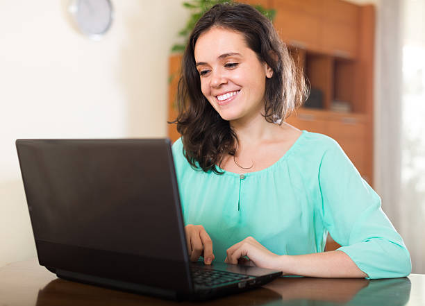 istock Young girl using laptop at home 536077333