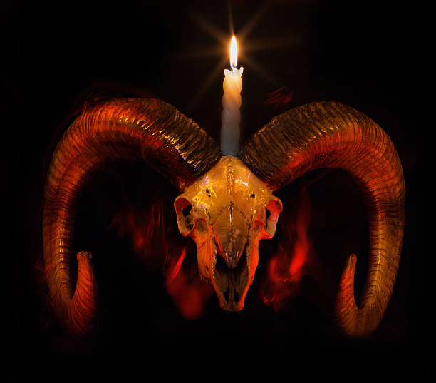 istock Skull of ram with lighted candle - Taro 536077385
