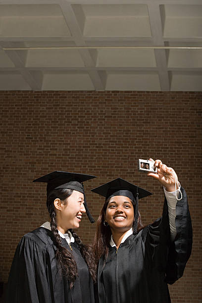 istock Two female graduates taking a photograph 536077847