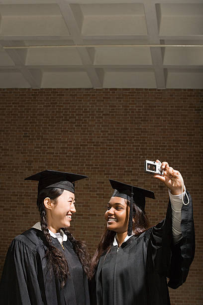 istock Two female graduates taking a photograph 536077879