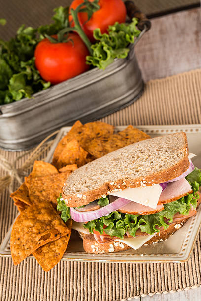 istock Ham Turkey Swiss Sandwich With Chips 536079307