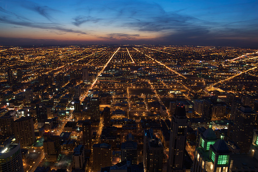 Aerial view of downtown Chicago at dusk, looking west.