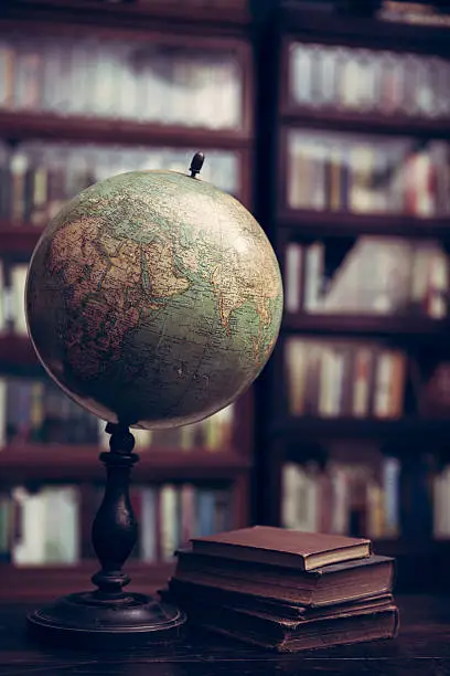 Photo of Antique globe and books