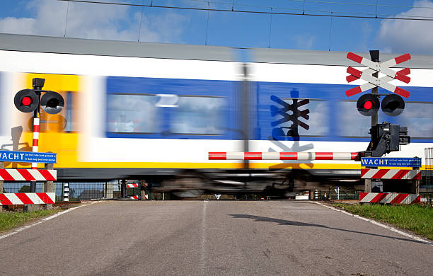 istock Railroad crossing with high speed train 536083121