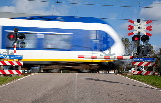 istock Railroad crossing with high speed train 536088803