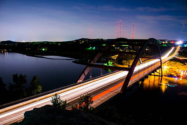 istock Pennybacker 360 Bridge Night Shot Bright Headlights Blue Sky Lake 536089411