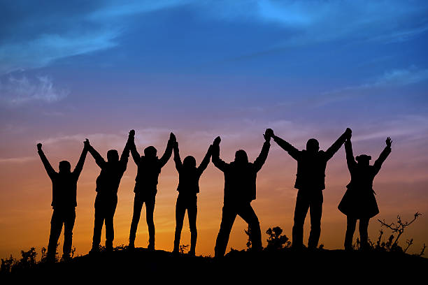 istock silhouettes of people on mountains 536091981