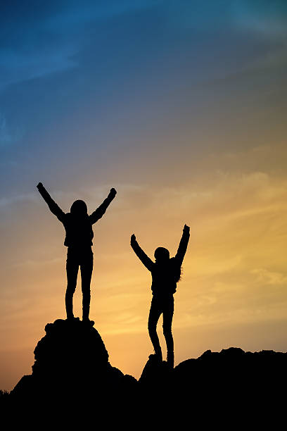 istock Two young girls on top during sundown. 536092003