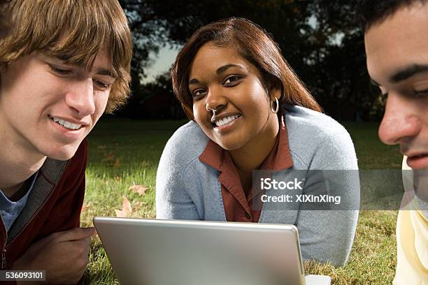 Three Students Studying Outdoors Stock Photo - Download Image Now - 2015, Adult, Adults Only