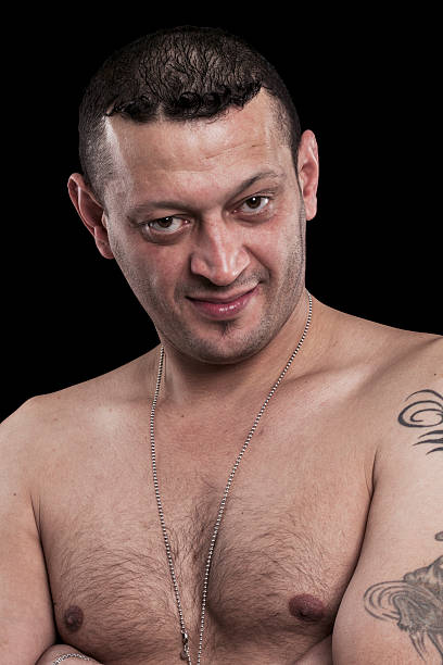 istock Bare-breasted man smiling with crossed arms 536094143
