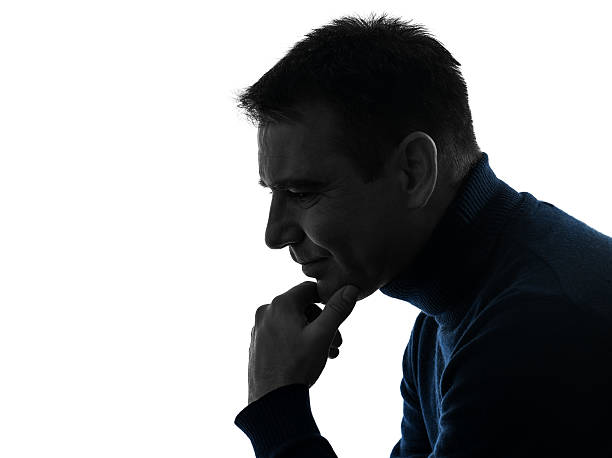 istock man serious thinking pensive silhouette portrait 536094301