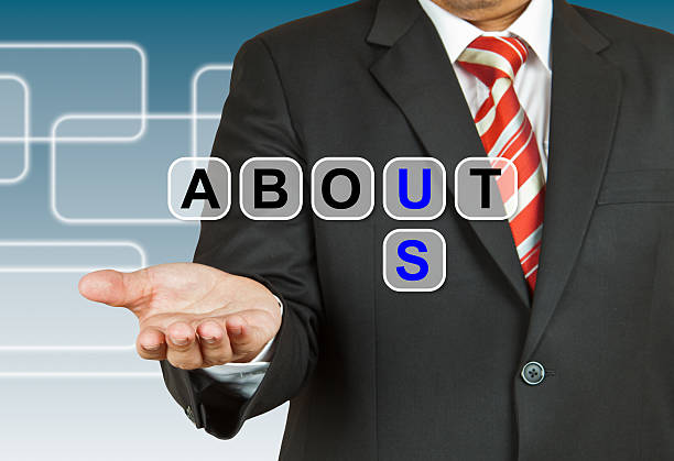istock Businessman hand drawing About Us 536095231