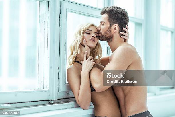 Handsome Man Kissing Blond Beauty Stock Photo - Download Image Now - Couple - Relationship, Sensuality, Sex Symbol