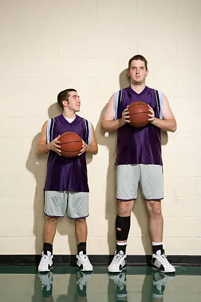 Photo of Tall and short basketball players