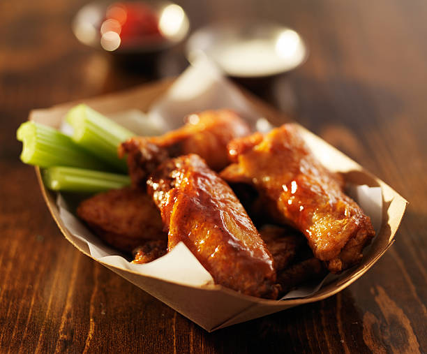istock buffalo chicken wings in basket with celery and ranch 536109745