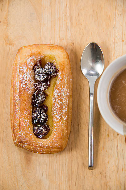 istock Cup of coffee and danish pastry. 536110419