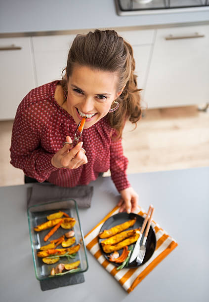 istock happy young housewife eating while serving baked pumpkin 536110879