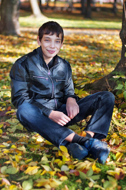 istock Teenager sitting on the ground 536111069