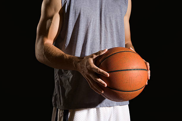 istock Man holding a basketball 536112859