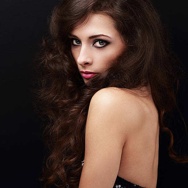 istock Beautiful young model with smokey eyes makeup and curly hair 536112963