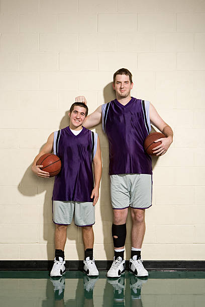 istock Tall and short basketball players 536114441