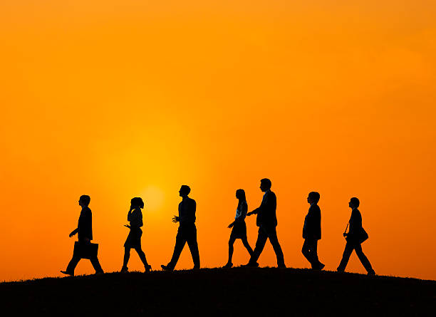 istock Silhouette Business People Walking Sunset Concept 536115309