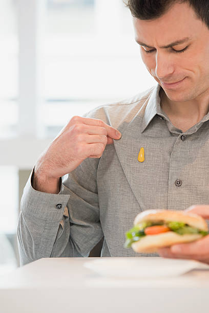 istock Man with mustard on his shirt 536134437