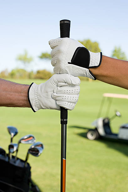 istock People holding golf club 536134489